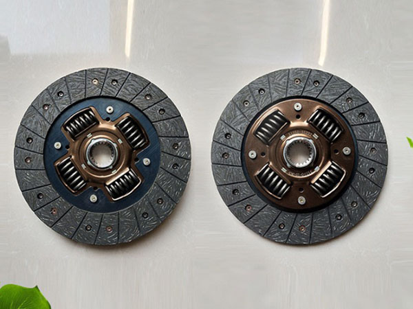 What is the function of a clutch pressure plate